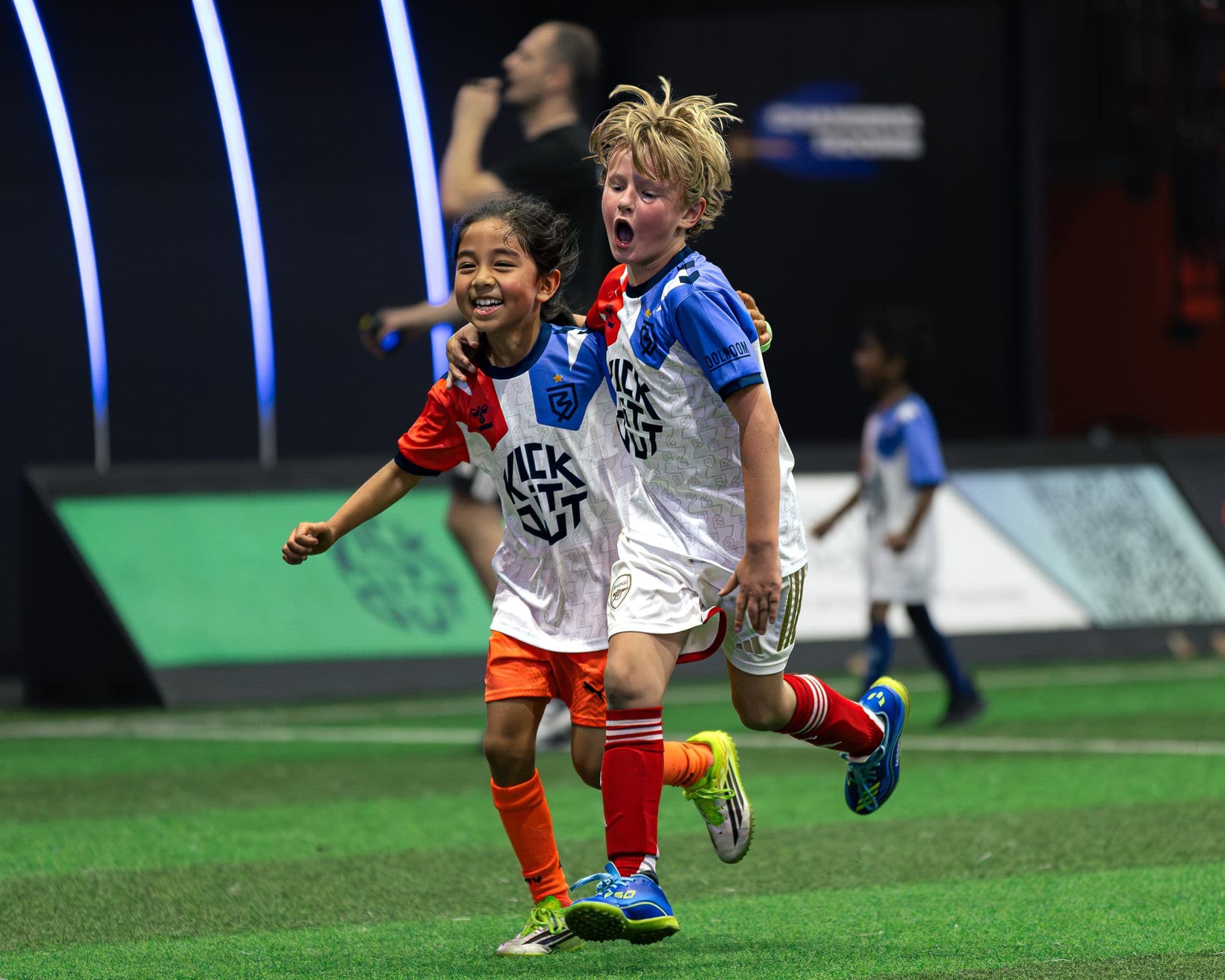Children enjoying a kids football party on the indoor pitch at Ballerz®